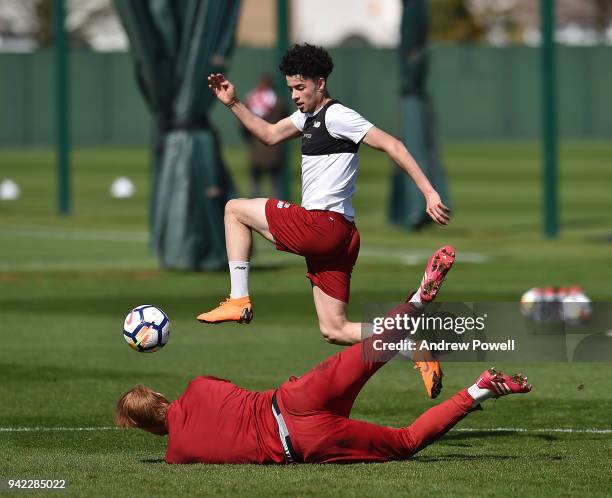 Curtis Jones and Adam Bogdan of Liverpool during a training session at Melwood Training Ground on April 5, 2018 in Liverpool, England.