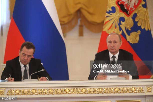 Russian President Vladimir Putin and Prime Minister Dmitry Medvedev attend the meeting of State Council at the Grand Kremlin Palace in Moscow,...