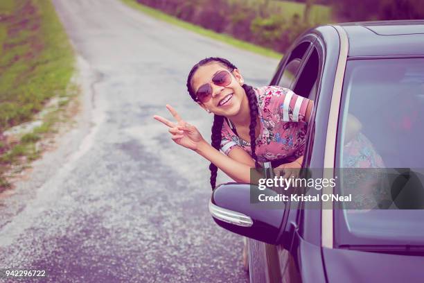 smiling teen girl on roadtrip - kristal stock pictures, royalty-free photos & images