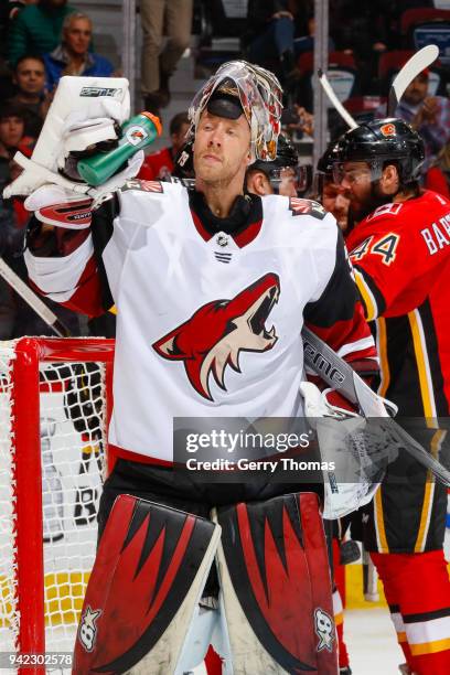 Antti Raanta of the Arizona Coyotes takes a break in an NHL game on April 3, 2018 at the Scotiabank Saddledome in Calgary, Alberta, Canada.