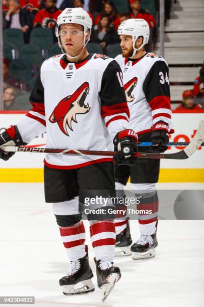 Max Domi and Zac Rinaldo in an NHL game on April 3, 2018 at the Scotiabank Saddledome in Calgary, Alberta, Canada.