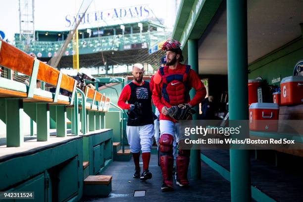 Blake Swihart and Dustin Pedroia of the Boston Red Sox walk through the dugout before the Opening Day game against the Tampa Bay Rays on April 5,...