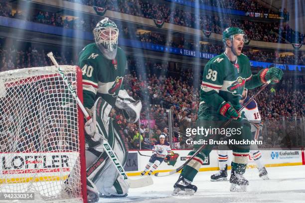 Nate Prosser and Devan Dubnyk of the Minnesota Wild defend against the Edmonton Oilers during the game at the Xcel Energy Center on April 2, 2018 in...