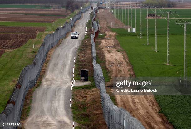 Hunagarian police van patrols the Hungarian-Serbian border on April 5 near the village of Gara Hungary. Hungary will hold a parliamentary election on...