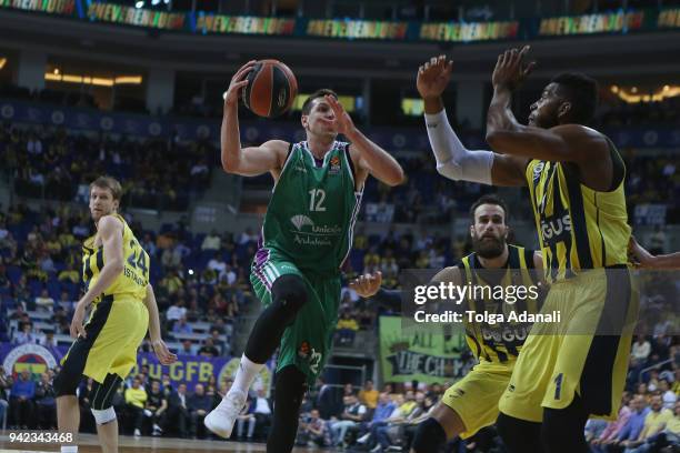 Dragan Milosavljevic, #12 of Unicaja Malaga in action with Jason Thompson, #1 of Fenerbahce Dogus during the 2017/2018 Turkish Airlines EuroLeague...