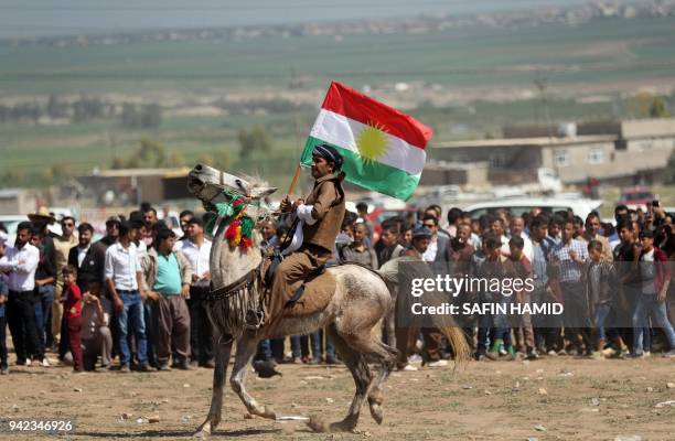 Iraqi Kurds take part in a cultural festival near Maqlub Mountains, 30 km northeast of Mosul, on April 5, 2018.