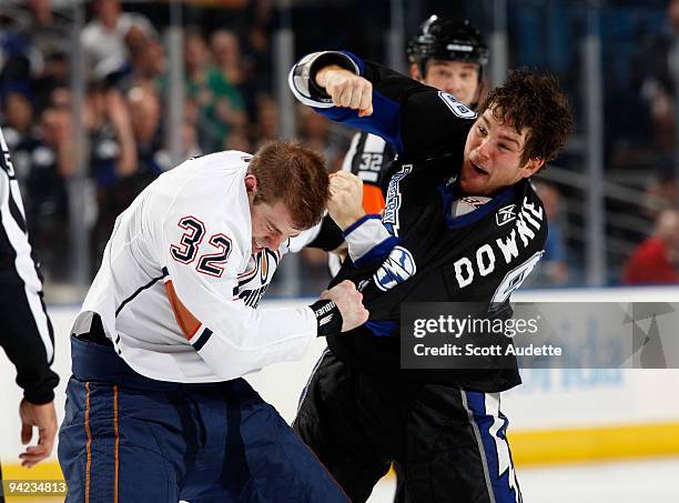 Steve Downie of the Tampa Bay Lightning throws a punch during a fight against Ryan Stone of the Edmonton Oilers at the St. Pete Times Forum on...