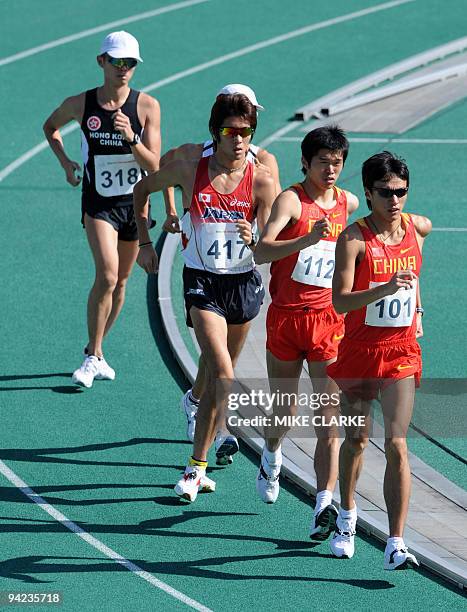 Chen Ding of China leads the pack from compatriot Yu Wei, Koichiro Morioka of Japan, Kim Hyun-sub of South Korea and Tse Chun Hung of Hong Kong at...