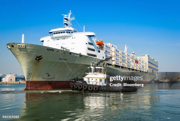 Tugboat guides the Matson Inc. Mokihana cargo ship into the Port of Long Beach in Long Beach, California, U.S., on Wednesday, April 4, 2018. The...