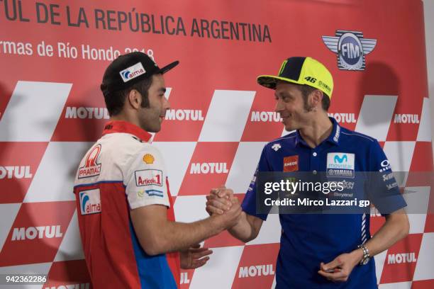 Cal Danilo Petrucci of Italy and Pramac Racing greets Valentino Rossi of Italy and Movistar Yamaha MotoGP during the press conference pre-event...