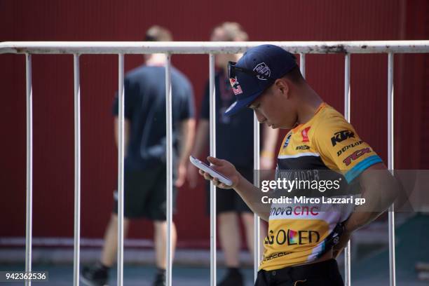 Kazuki Masaki of Japan and RBA Boe Skull Rider KTM looks on the mobile phone in paddock during the MotoGp of Argentina - Previews on April 5, 2018 in...