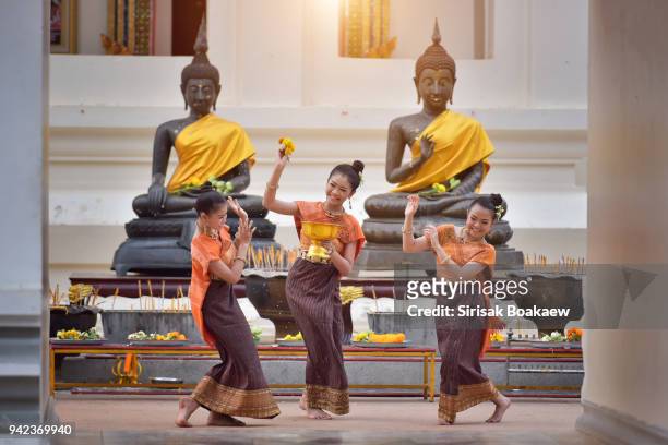 thai girls splashing water during festival songkran - heritage festival presented stock pictures, royalty-free photos & images