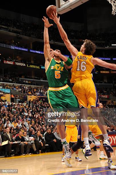 Carlos Boozer of the Utah Jazz has his shot blocked by Pau Gasol of the Los Angeles Lakers at Staples Center on December 9, 2009 in Los Angeles,...