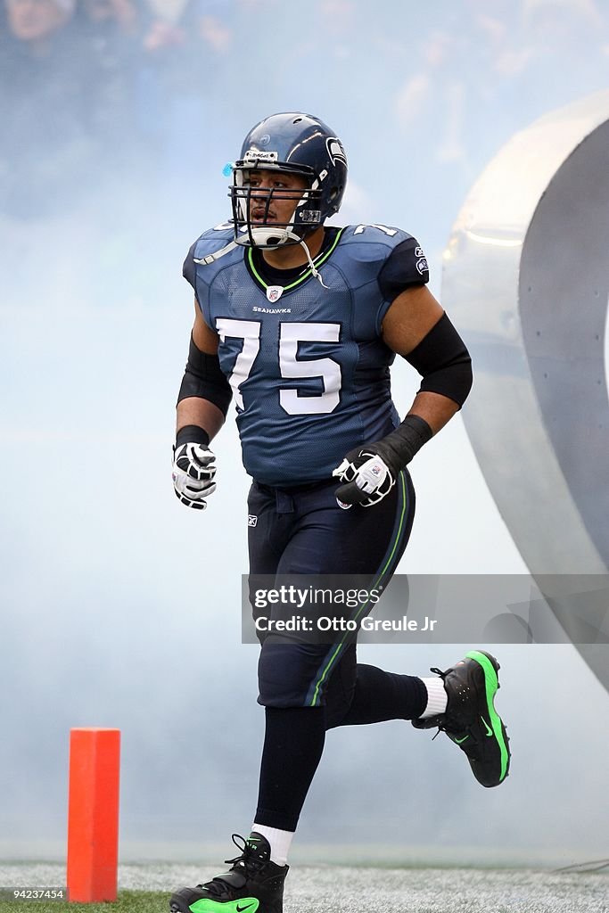 Sean Locklear Sean Locklear of the Seattle Seahawks jogs onto the field prior to ...