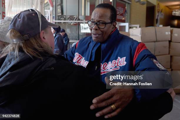 Hall of Fame player Rod Carew greets fans as they enter the gates before the home opening game between the Minnesota Twins and the Seattle Mariners...