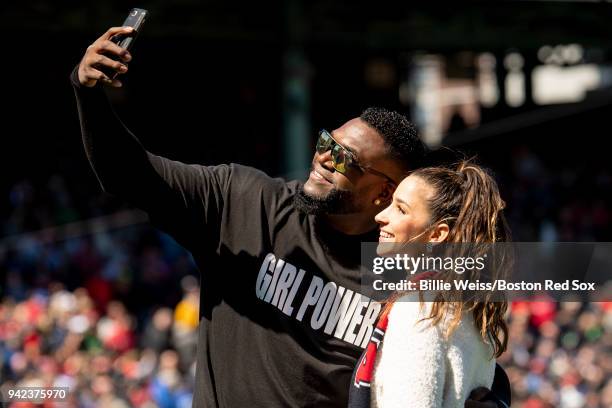 Former designated hitter David Ortiz of the Boston Red Sox poses for a selfie photograph wearing a shirt displaying a 'Girl Power' message alongside...