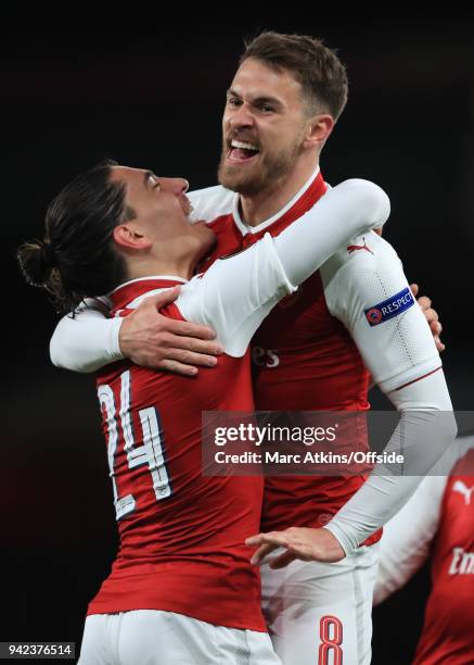 Aaron Ramsey of Arsenal celebrates scoring the opening goal with Hector Bellerin during the UEFA Europa League quarter final leg one match between...