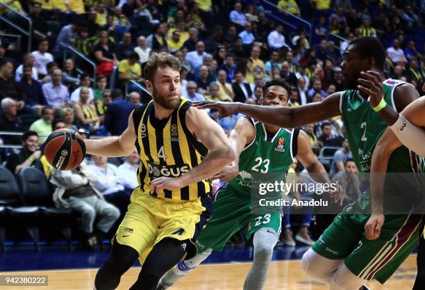 Nicolo Melli of Fenerbahce Dogus in action against Jeff Brooks and Viny Okuuo of Unicaja Malaga during the Turkish Airlines Euroleague basketball...