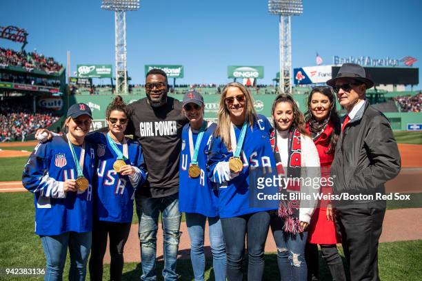 Meghan Duggan, Brianna Decker, Kacey Bellamy, and Amanda Pelkey of the United States Women's Olympic Hockey pose for a photograph with former Boston...