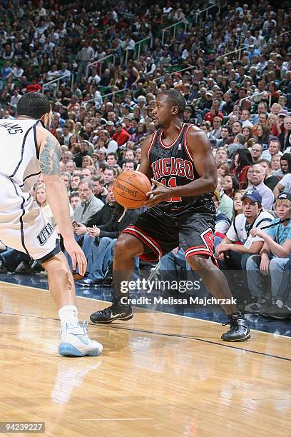 Lindsey Hunter of the Chicago Bulls drives the ball against Deron Williams of the Utah Jazz during the game on November 26, 2009 at EnergySolutions...