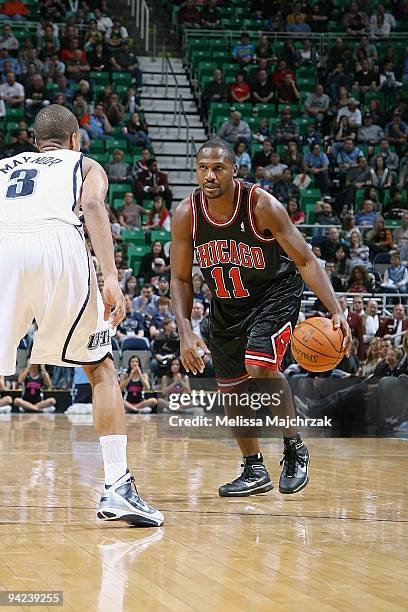 Lindsey Hunter of the Chicago Bulls drives the ball against Eric Maynor of the Utah Jazz during the game on November 26, 2009 at EnergySolutions...