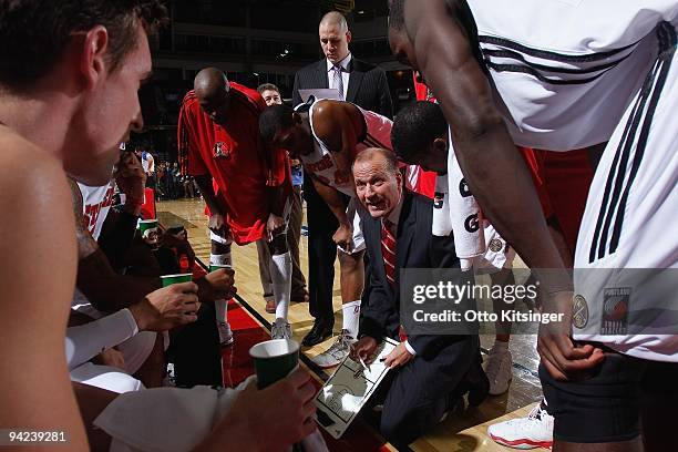 Head coach Robert MacKinnon of the Idaho Stampede draws up a play in the huddle during the D-League game against the Reno Bighorns at Qwest Arena on...