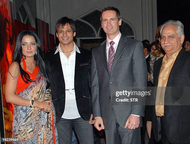 Indian Bollywood personalities Celina Jaitley , Vivek Oberoi , director Ramesh Sippy and Dalton McGuinty pose during an event announcing Ontario,...