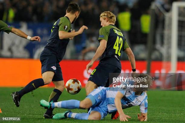 Dusan Basta of SS Lazio compete for the ball with Andreas Ulmer of Salzburg RB during the UEFA Europa League quarter final leg one match between...