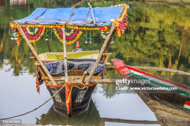 colorful tourist boats in palolem beach - palolem beach stock pictures, royalty-free photos & images
