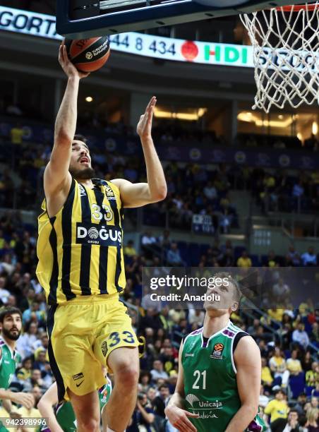 Nikola Kalinic of Fenerbahce Dogus in action against Adam Waczynski of Unicaja Malaga during the Turkish Airlines Euroleague basketball match between...