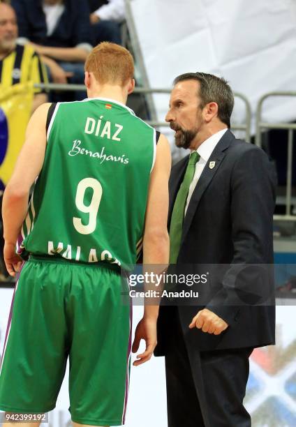 Head coach of Unicaja Malaga Joan Plaza gives tactics to his players Alberto Diaz during the Turkish Airlines Euroleague basketball match between...