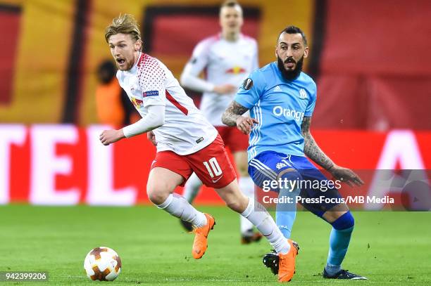 Emil Forsberg of RB Leipzig competes with Kostas Mitroglou of Olympique Marseille during the UEFA Europa League quarter final leg one match between...