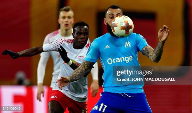 Marseille's Greek forward Konstantinos Mitroglou and Leipzig's Portuguese midfielder Bruma vie for the ball during the UEFA Europa League...