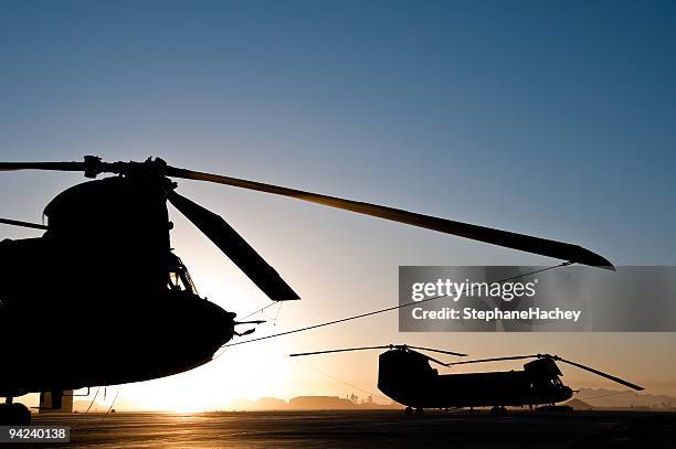 chinook helicopter silhouette sunrise - chinook stock pictures, royalty-free photos & images