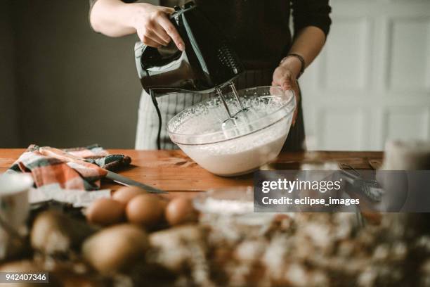 young hous wife mixing wiped cream - wife beater stock pictures, royalty-free photos & images