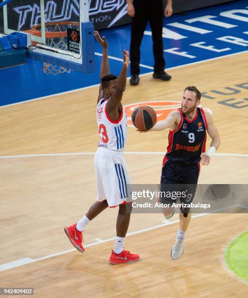 Marcelinho Huertas, #9 of Baskonia Vitoria Gasteiz competes with Toney Douglas, #23 of Anadolu Efes Istanbul during the 2017/2018 Turkish Airlines...