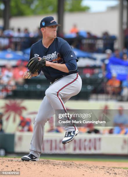 Dan Winkler of the Atlanta Braves pitches during the Spring Training game against the Detroit Tigers at Publix Field at Joker Marchant Stadium on...