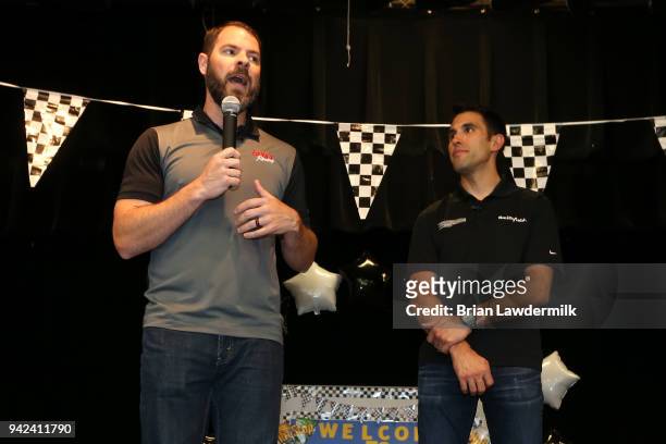 Lionel Racing Director of e-Commerce Thomas DeBoyance and NASCAR Cup driver Aric Almirola speak on stage during a suprise visit to announce the...