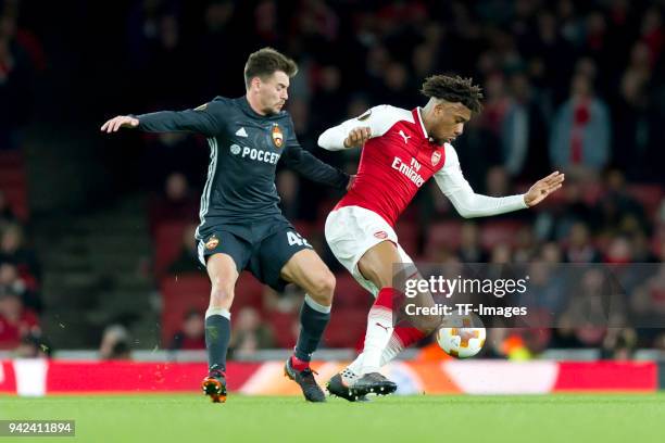 Georgi Schennikov of Moskva and Alex Iwobi of Arsenal battle for the ball during the UEFA UEFA Europa League Quarter-Final first leg match between...