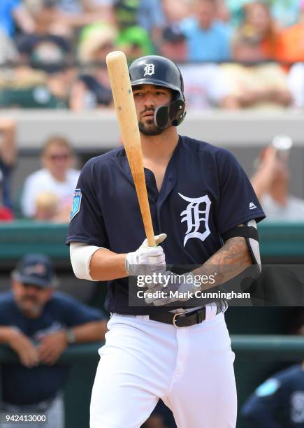 Nicholas Castellanos of the Detroit Tigers looks on while batting during the Spring Training game against the Atlanta Braves at Publix Field at Joker...