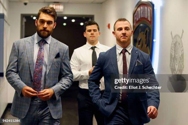 Ian McCoshen and teammates MacKenzie Weegar and and Connor Brickley of the Florida Panthers arrive for tonights game against the Boston Bruins at the...