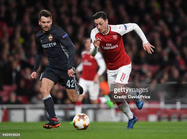 Mesut Ozil of Arsenal takes on Georgi Schennikov of CSKA during the UEFA Europa League quarter final leg one match between Arsenal FC and CSKA Moskva...