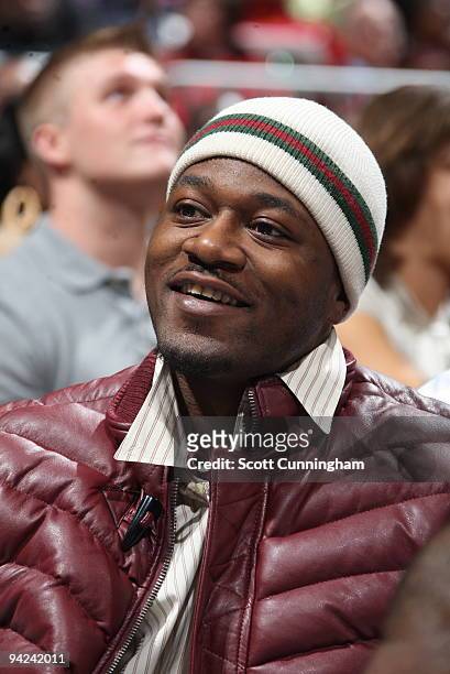 Former NFL player Adam "Pacman" Jones watches the action between the Atlanta Hawks and the Chicago Bulls on December 9, 2009 at Philips Arena in...