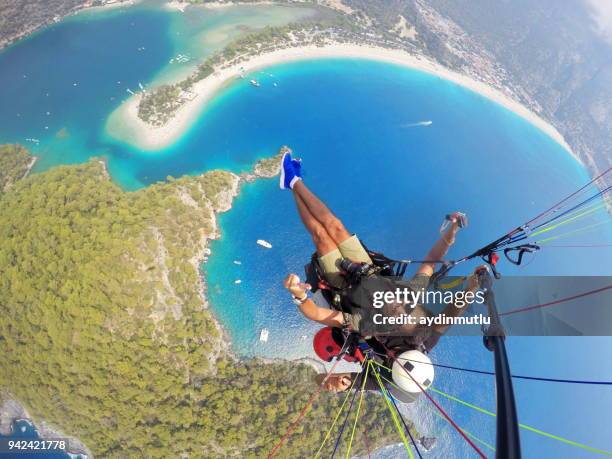 paragliding on oludeniz fethiye - parasailing stock pictures, royalty-free photos & images