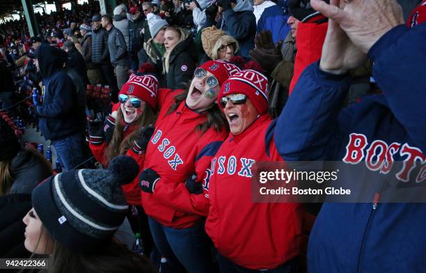 From left, sisters Rebecca Rippon and Shannon Gethard join their parents Allyson and Charles Stuart in singing "Take Me Out to the Ball Game" during...