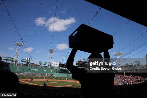 Vendor passes down a set of steps during the game. The Boston Red Sox host the Tampa Bay Rays in their home opener for the 2018 MLB season at Fenway...