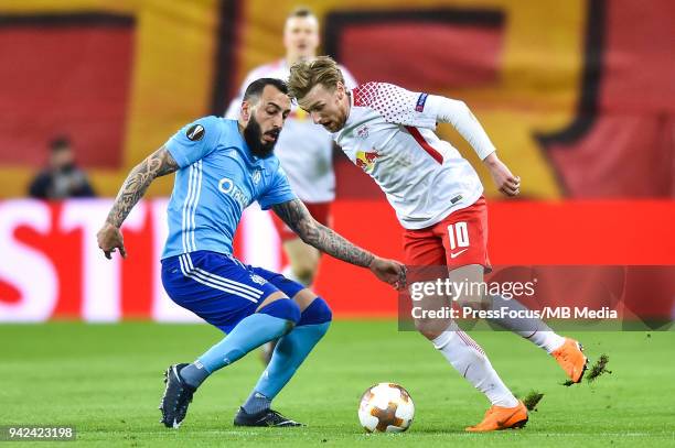 Kostas Mitroglou of Olympique Marseille competes with Emil Forsberg of RB Leipzig during the UEFA Europa League quarter final leg one match between...