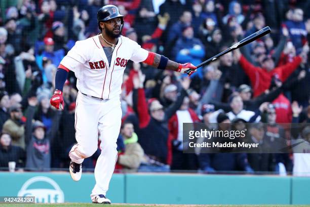 Hanley Ramirez of the Boston Red Sox celebrates after hitting a walk off single, driving in Jackie Bradley Jr. #19, during the twelfth inning of the...