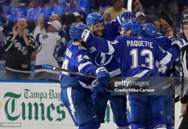 Members of the Tampa Bay Lightning, from left, Ryan Callahan, Victor Hedman, Cedric Paquette and Chris Kunitz celebrate a goal against the Boston...