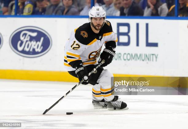 Brian Gionta of the Boston Bruins brings the puck up against the Tampa Bay Lightning during the third period of the game at the Amalie Arena on April...